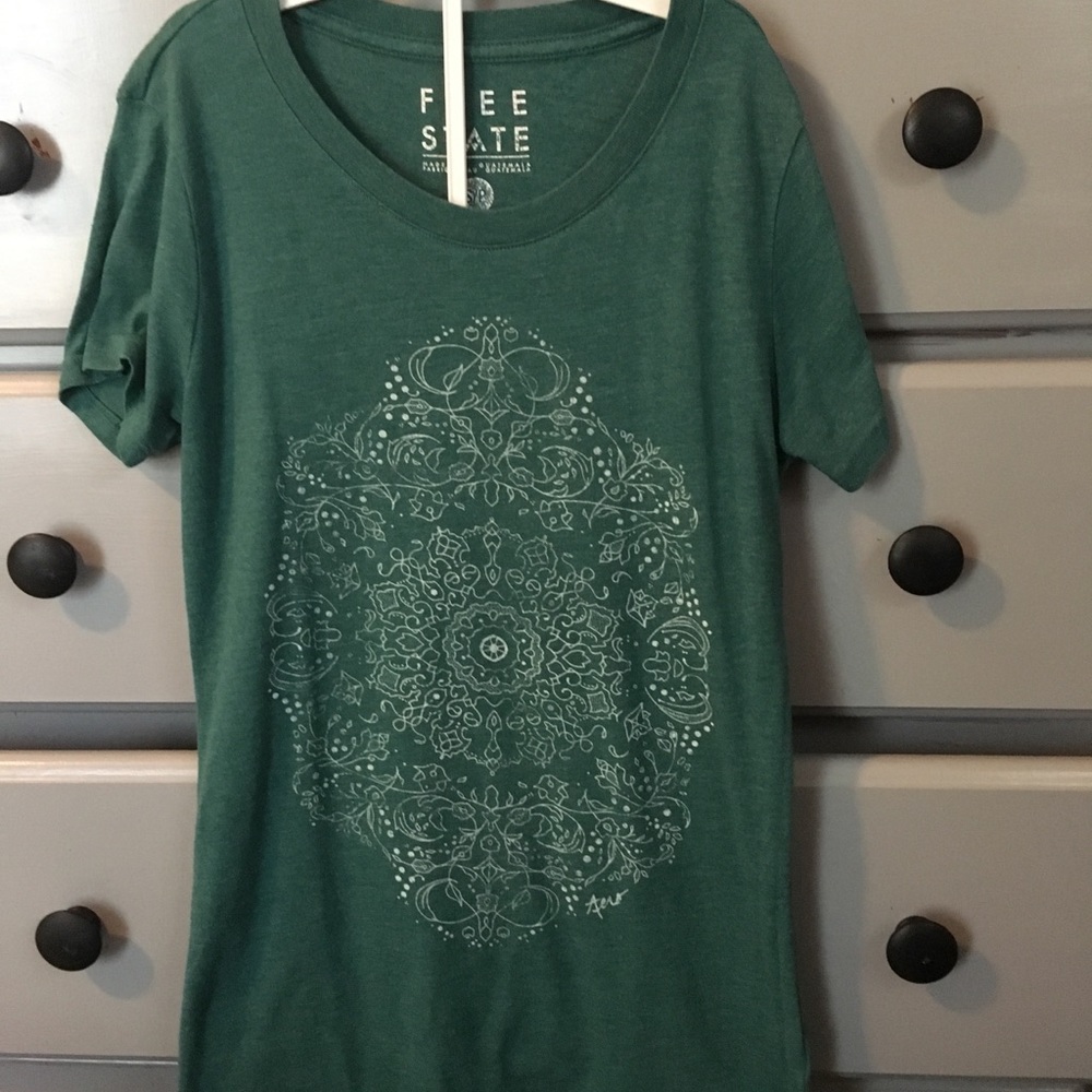 Sea green T-shirt with print on it
